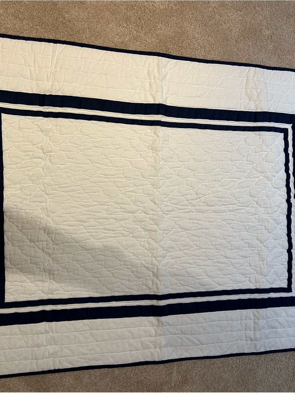 Pottery Barn Kids White Quilted crib blanket with Navy Trim